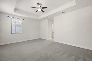 Experience luxury living in this stunning 3-bedroom, 2.5-bath on Eagle Creek Golf Club in Florida - for sale on GolfHomes.com, golf home, golf lot