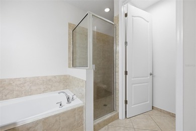 Experience luxury living in this stunning 3-bedroom, 2.5-bath on Eagle Creek Golf Club in Florida - for sale on GolfHomes.com, golf home, golf lot