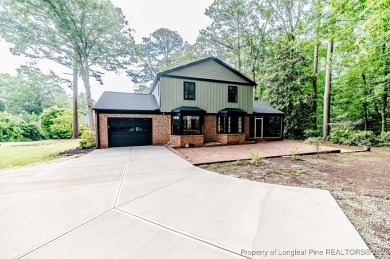 Welcome to 225 Lakeview Drive - a beautifully updated 2-story on Carolina Trace Country Club in North Carolina - for sale on GolfHomes.com, golf home, golf lot