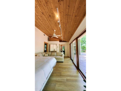 Wonderful modern style home in the piney woods of east Texas on Pine Dunes Golf Course in Texas - for sale on GolfHomes.com, golf home, golf lot