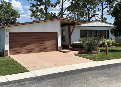 Enjoy resort-style living in this well-maintained 2-bedroom on Del Tura Golf and Country Club in Florida - for sale on GolfHomes.com, golf home, golf lot