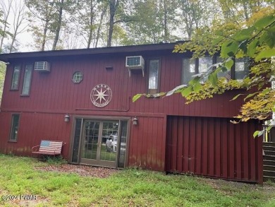 Time to cozy up....nestled in the trees find this 3 bedroom home on The Hideout Golf in Pennsylvania - for sale on GolfHomes.com, golf home, golf lot