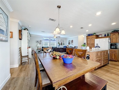 INTRODUCING this VERY unique, yet MODERN, hurricane RESISTANT on Lily Lake Golf and RV Resort in Florida - for sale on GolfHomes.com, golf home, golf lot