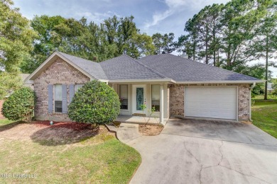 This charming home combines comfort and convenience, featuring on Diamondhead Country Club in Mississippi - for sale on GolfHomes.com, golf home, golf lot