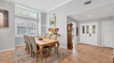 Lakefront villa that lives like a home, but without the hassle on The Meadows Golf and Country Club in Florida - for sale on GolfHomes.com, golf home, golf lot