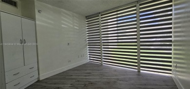 Welcome to this greatly remodeled 1 bedroom 1 bathroom condo on Country Club of Miami in Florida - for sale on GolfHomes.com, golf home, golf lot