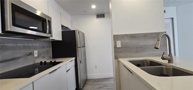 Welcome to this greatly remodeled 1 bedroom 1 bathroom condo on Country Club of Miami in Florida - for sale on GolfHomes.com, golf home, golf lot