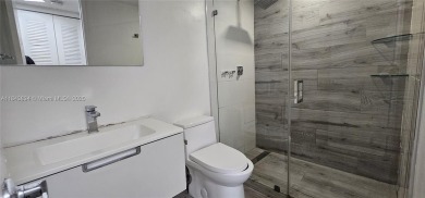 Welcome to this greatly remodeled 1 bedroom 1 bathroom condo on Country Club of Miami in Florida - for sale on GolfHomes.com, golf home, golf lot