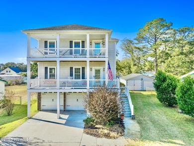 Designed for the best of coastal living! Impressive Sunset Beach on Sea Trail Golf Resort in North Carolina - for sale on GolfHomes.com, golf home, golf lot