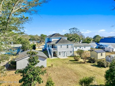 Designed for the best of coastal living! Impressive Sunset Beach on Sea Trail Golf Resort in North Carolina - for sale on GolfHomes.com, golf home, golf lot