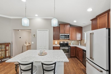 Step into pristine, easy-living perfection in Savona North with on Venetian Bay Golf Course in Florida - for sale on GolfHomes.com, golf home, golf lot