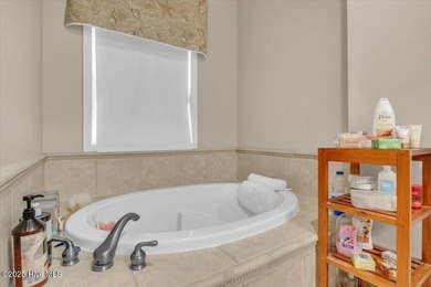 Welcome to this inviting 3-bedroom, 2-bath home in Lockwood on Lockwood Folly Country Club in North Carolina - for sale on GolfHomes.com, golf home, golf lot