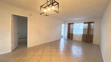 Spacious 1/1 condo featuring a kitchen with easy pass-through to on Lauderhill Golf Course in Florida - for sale on GolfHomes.com, golf home, golf lot