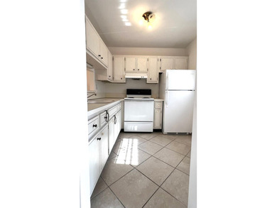 Spacious 1/1 condo featuring a kitchen with easy pass-through to on Lauderhill Golf Course in Florida - for sale on GolfHomes.com, golf home, golf lot