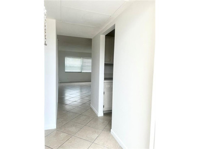Spacious 1/1 condo featuring a kitchen with easy pass-through to on Lauderhill Golf Course in Florida - for sale on GolfHomes.com, golf home, golf lot