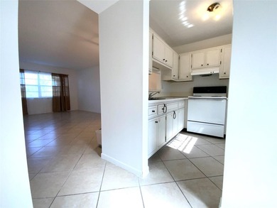 Spacious 1/1 condo featuring a kitchen with easy pass-through to on Lauderhill Golf Course in Florida - for sale on GolfHomes.com, golf home, golf lot