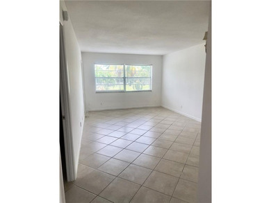 Spacious 1/1 condo featuring a kitchen with easy pass-through to on Lauderhill Golf Course in Florida - for sale on GolfHomes.com, golf home, golf lot