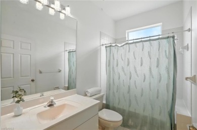 This 2-bedroom plus den villa offers sweeping golf course views on Estero Country Club in Florida - for sale on GolfHomes.com, golf home, golf lot