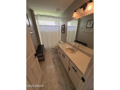 This Johnson-built block home is move in ready, located in the on Turnbull Bay Golf Club in Florida - for sale on GolfHomes.com, golf home, golf lot