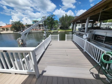 Are you looking for FLORIDA LIFESTYLE! WATERFRONT! Beautiful on Rocky Point Golf Course in Florida - for sale on GolfHomes.com, golf home, golf lot