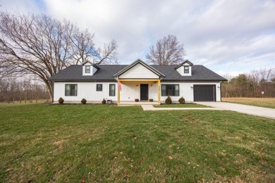 In 2021 this single-story home was custom-built on over half an on Mill Creek Golf Club in Ohio - for sale on GolfHomes.com, golf home, golf lot