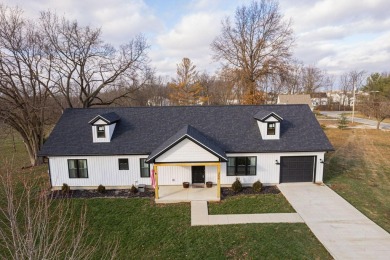 In 2021 this single-story home was custom-built on over half an on Mill Creek Golf Club in Ohio - for sale on GolfHomes.com, golf home, golf lot