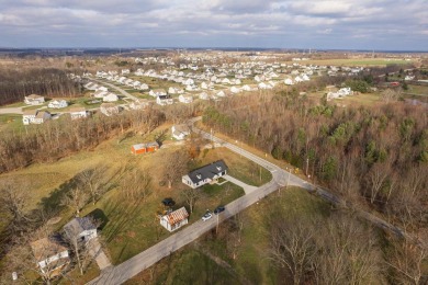 In 2021 this single-story home was custom-built on over half an on Mill Creek Golf Club in Ohio - for sale on GolfHomes.com, golf home, golf lot