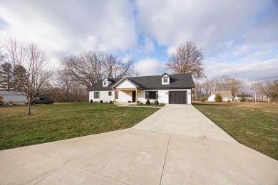 In 2021 this single-story home was custom-built on over half an on Mill Creek Golf Club in Ohio - for sale on GolfHomes.com, golf home, golf lot