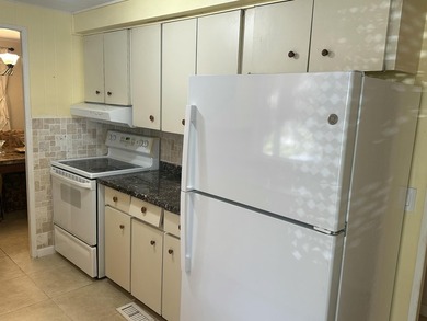 Rarely available lakefront 2BR/2BA double-wide coach home in on Boca Grove Golf and Tennis in Florida - for sale on GolfHomes.com, golf home, golf lot