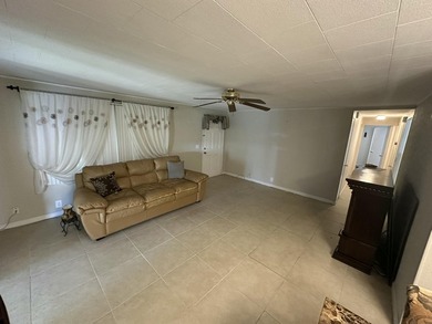 Rarely available lakefront 2BR/2BA double-wide coach home in on Boca Grove Golf and Tennis in Florida - for sale on GolfHomes.com, golf home, golf lot
