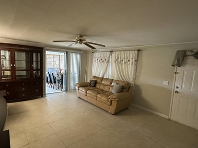 Rarely available lakefront 2BR/2BA double-wide coach home in on Boca Grove Golf and Tennis in Florida - for sale on GolfHomes.com, golf home, golf lot