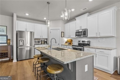 Welcome to this charming home in the highly sought-after on Traditions of Braselton Golf Club in Georgia - for sale on GolfHomes.com, golf home, golf lot