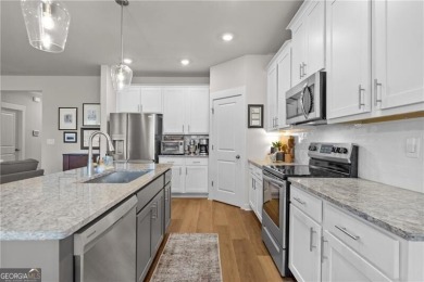 Welcome to this charming home in the highly sought-after on Traditions of Braselton Golf Club in Georgia - for sale on GolfHomes.com, golf home, golf lot