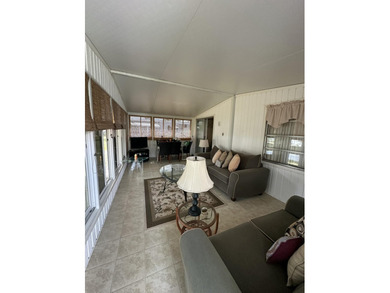 Rarely available lakefront 2BR/2BA double-wide coach home in on Boca Grove Golf and Tennis in Florida - for sale on GolfHomes.com, golf home, golf lot