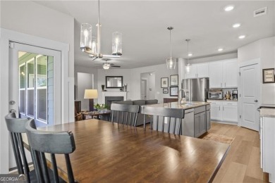 Welcome to this charming home in the highly sought-after on Traditions of Braselton Golf Club in Georgia - for sale on GolfHomes.com, golf home, golf lot