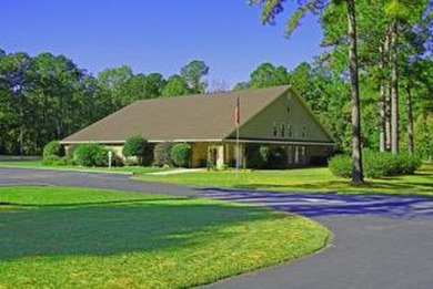 Wooded lot on Lake Arbu Drive that backs up to Players Golf on Players Course At Wyboo Plantation in South Carolina - for sale on GolfHomes.com, golf home, golf lot