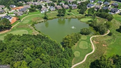 Welcome to this charming home in the highly sought-after on Traditions of Braselton Golf Club in Georgia - for sale on GolfHomes.com, golf home, golf lot