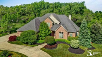 This Traditional all-brick home, nestled on a  3/4 -acre lot on Monroe Golf and Country Club in Michigan - for sale on GolfHomes.com, golf home, golf lot