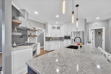 Experience the best of golf and lake living in this 4-bedroom, 2 on The Patriot Golf Club At Grand Harbor in South Carolina - for sale on GolfHomes.com, golf home, golf lot