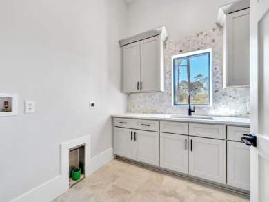 Introducing the epitome of Luxury Waterfront Living- a on Kelly Plantation Golf Club in Florida - for sale on GolfHomes.com, golf home, golf lot