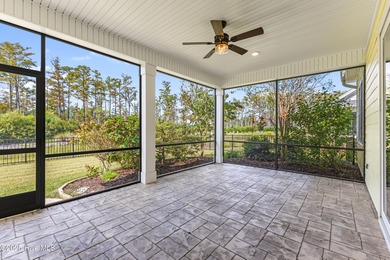 Welcome to this stunning 3-bedroom, 2.5-bathroom home in the on Cape Fear National At Brunswick Forest in North Carolina - for sale on GolfHomes.com, golf home, golf lot