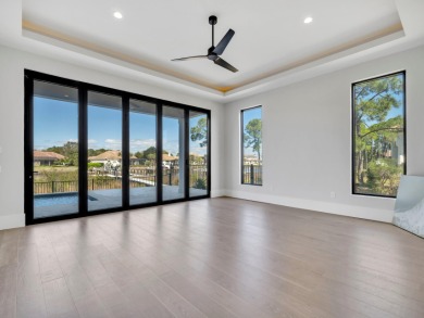 Introducing the epitome of Luxury Waterfront Living- a on Kelly Plantation Golf Club in Florida - for sale on GolfHomes.com, golf home, golf lot