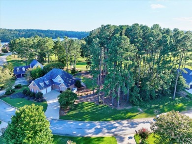 Experience the best of golf and lake living in this 4-bedroom, 2 on The Patriot Golf Club At Grand Harbor in South Carolina - for sale on GolfHomes.com, golf home, golf lot