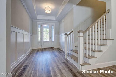 The Otter by American Homesmith offers easy, coastal living in on Lennon Hills Golf Course in North Carolina - for sale on GolfHomes.com, golf home, golf lot