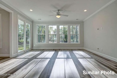 The Otter by American Homesmith offers easy, coastal living in on Lennon Hills Golf Course in North Carolina - for sale on GolfHomes.com, golf home, golf lot