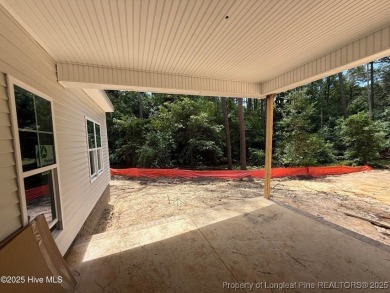 Now available and nearing completion, the 'Lindie' single level on Foxfire Golf and Country Club in North Carolina - for sale on GolfHomes.com, golf home, golf lot