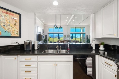 Walls of glass frame panoramic southern views of lake, fairway on PGA West Private Golf Courses in California - for sale on GolfHomes.com, golf home, golf lot