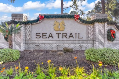 Coastal luxury meets low-maintenance living in this beautifully on Sea Trail Golf Resort in North Carolina - for sale on GolfHomes.com, golf home, golf lot