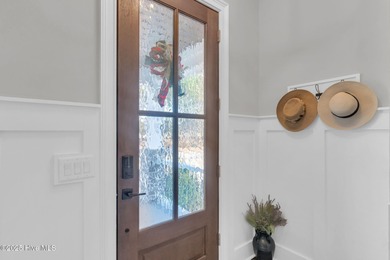 Coastal luxury meets low-maintenance living in this beautifully on Sea Trail Golf Resort in North Carolina - for sale on GolfHomes.com, golf home, golf lot