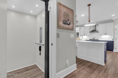 Coastal luxury meets low-maintenance living in this beautifully on Sea Trail Golf Resort in North Carolina - for sale on GolfHomes.com, golf home, golf lot